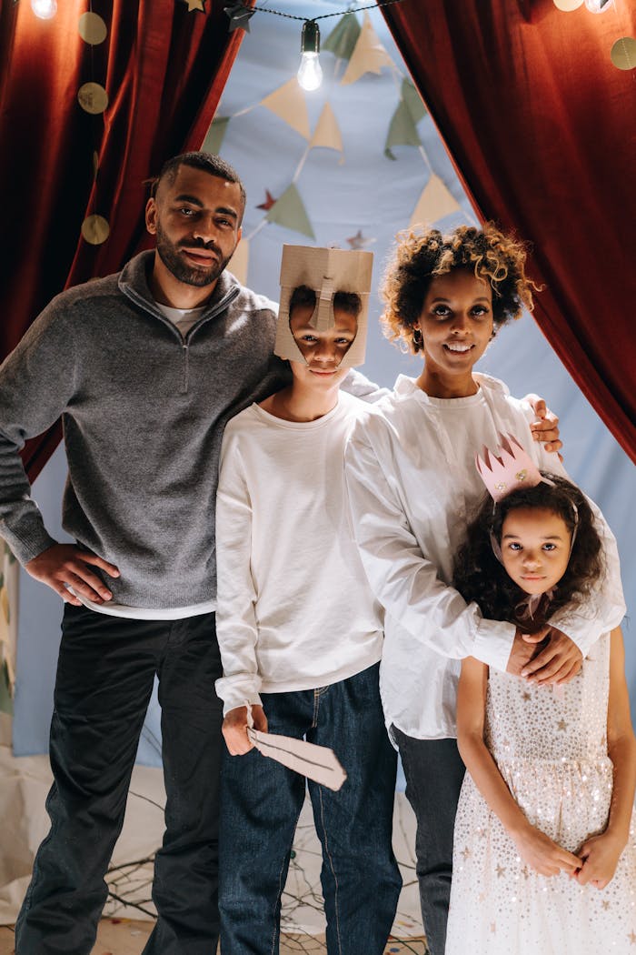 A family engages in a fun and creative home theatre activity, showcasing bonding and happiness.